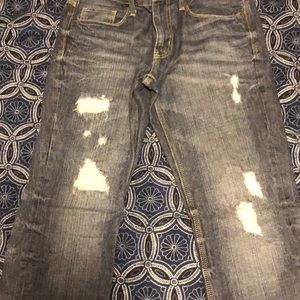 Helix rip and repaired designer denim jeans